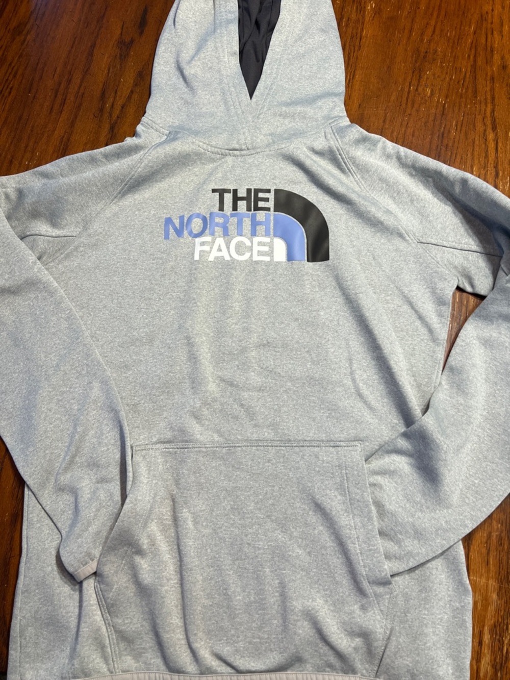 The North Face Light Gray Hoodie with Black, Blue & White Logo